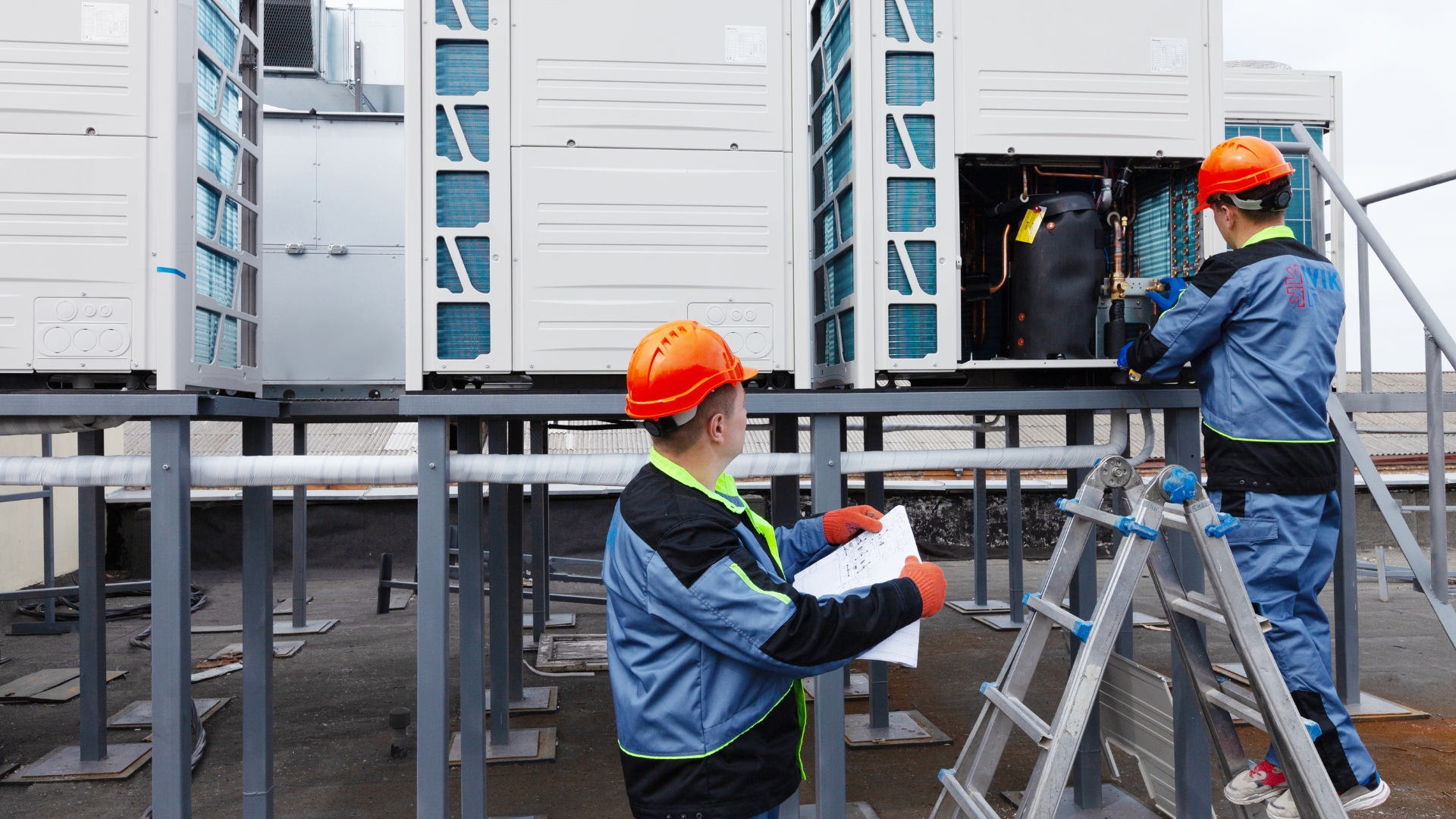 ACG technician inspecting rooftop commercial HVAC system in El Paso
