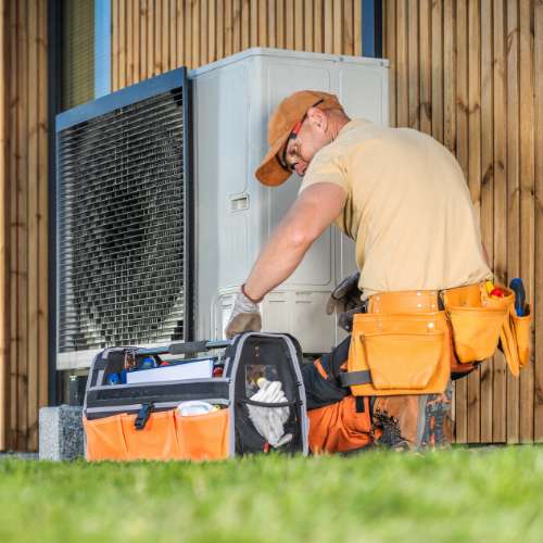 ACG technician installing a heat pump unit at a public facility in Texas.