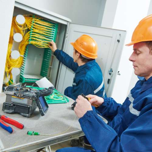 Contractor with CMMC documentation preparing for a federal telecom installation.